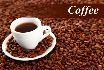 Cup of coffee on coffee beans background