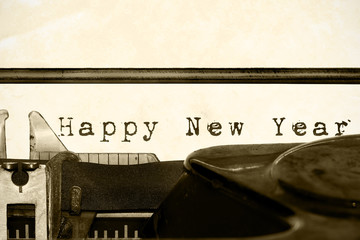 Inscription "Happy New Year" written on an old typewriter