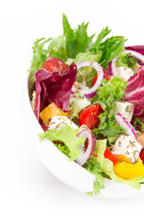 Fresh tasty salad over white