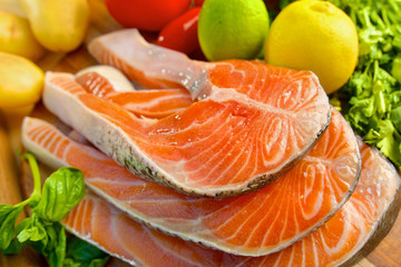 Delicious  portion of fresh salmon fillet with vegetables
