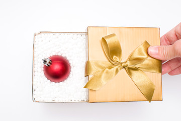 Gift box with a christmas ball inside