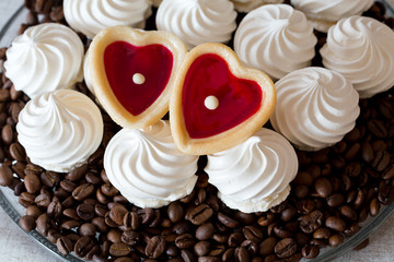 French vanilla meringue cookies and two sweet hearts