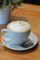 Cappuccino Cup On The Wooden Table