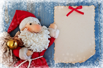 Christmas card with Santa Claus. Soft toy.