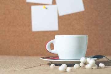 Obraz na płótnie Canvas Cup of hot drink with coffee beans