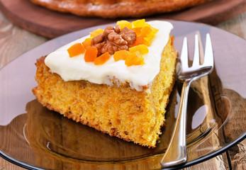 Piece of carrot pie on glass plate