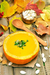 Pumpkin soup on rustic table