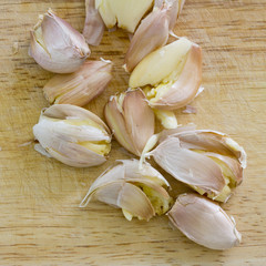 chopped garlic isolated on a wooden board
