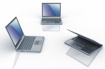 Three laptops isolated over white background