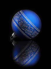Blue Christmas ball on black background with reflection