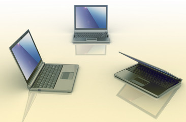 Three laptops isolated over white background