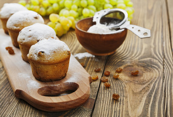 Homemade muffins with raisins and powdered sugar