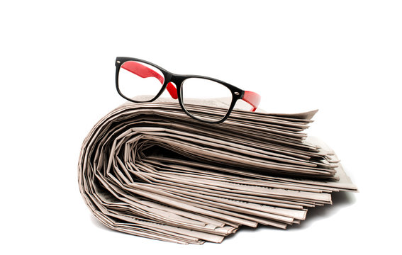 newspaper with glasses