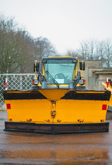 Tractor with plow-frame. Winter road services.