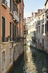 Fototapeta na wymiar Narrow canal in Venice, Italy