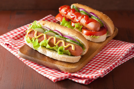hotdog with ketchup mustard and vegetables