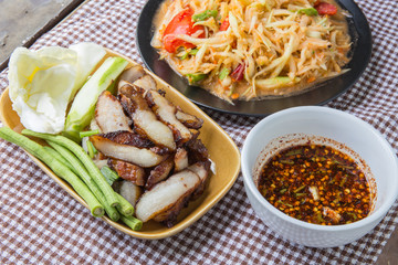 Closeup Thai papaya, charcoal-boiled pork neck,Grill pork (popular food Thailand)