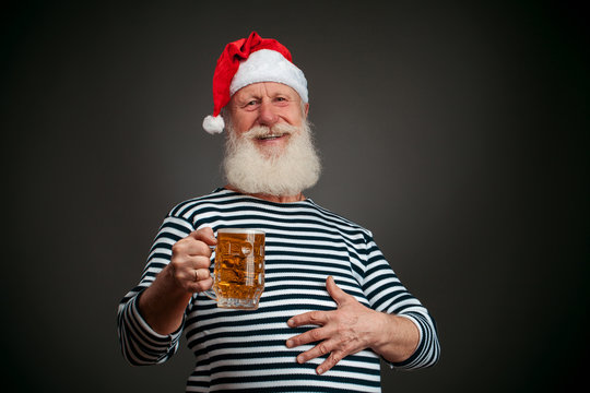 Handsome sailor. Seaman. Santa claus with beer