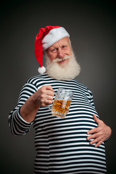 Handsome sailor. Seaman. Santa claus with beer