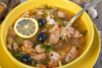 Meat soup in a bowl close up.