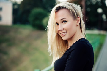 Naklejka premium beautiful blonde girl portrait on the street