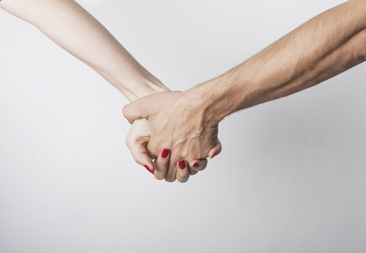 Woman and man hand in hand