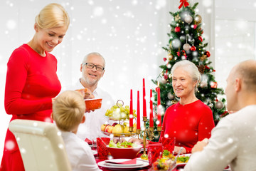 smiling family having holiday dinner at home