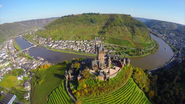 Castle on river island, medieval landscape, aerial, ships bridge