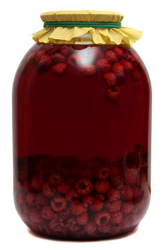 Jar with raspberry compote on  white background