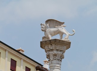 A statue on a column of the lion of saint mark in Vicenza