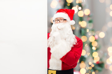 man in costume of santa claus with billboard