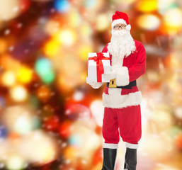 man in costume of santa claus with gift box