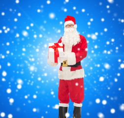 man in costume of santa claus with gift box
