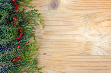 Christmas fir tree on wooden background