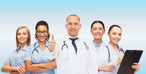 Fototapeta premium group of smiling doctors with showing thumbs up