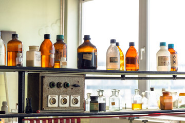 old laboratory with a lot of bottles - 73387701