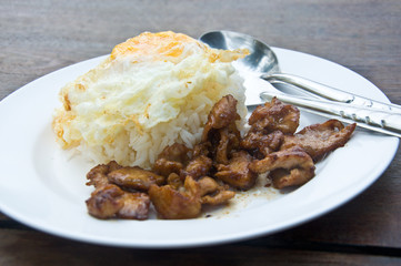 Rice with pork fried with garlic and black pepper and fried Egg.