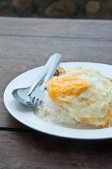 Rice with pork fried with garlic and black pepper and fried Egg.