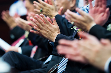 applauding at meeting