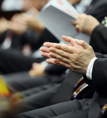 applauding at meeting