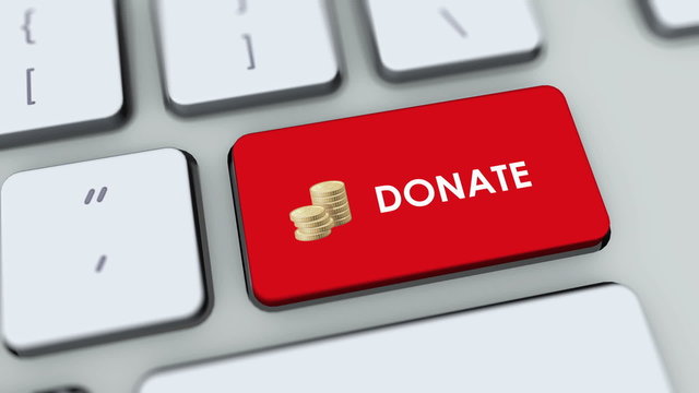 Donate button on computer keyboard. Key is pressed
