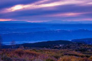 Obraz na płótnie Canvas Colorful Dramatic Sunset Sky over the City of Moab Fall Colors
