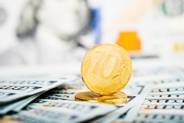 russian roubles coins on banknotes of  dollars