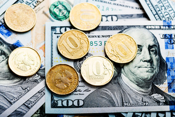 russian roubles coins on banknotes of  dollars