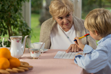 Granny helping his grandson