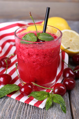 Fresh cold cherry cocktail with mint and lemon
