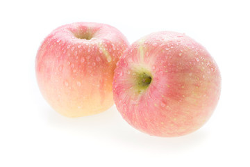apple fuji fruit with water drops on white background