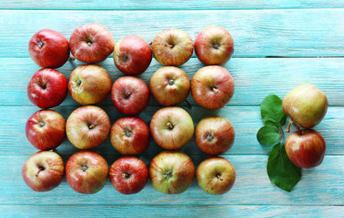 Juicy apples on wooden background