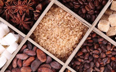 Wooden box with set of coffee and cocoa beans, sugar cubes,