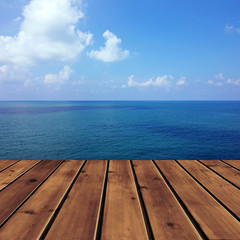 Naklejka na ściany i meble Ocean with sky and wood floor